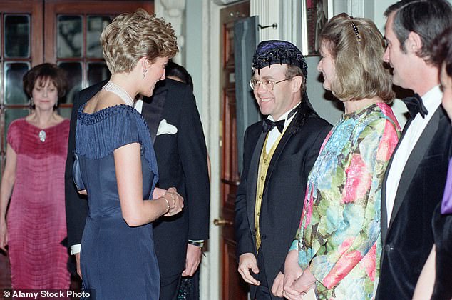 Elton John chatting to Princess Diana when she attended a charity performance of Tango Argentino in aid of the National Aids Trust at the Aldwych Theater in London in 1991.