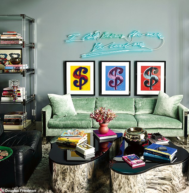 In the game room/living room: a Tracey Emin neon light sculpture and Warhol dollar sign art.  The '70s sofa is by mid-century modern master Milo Baughman;  the tables are vintage Karl Springer.  Slogan neon art is available at godsownjunkyard.co.uk