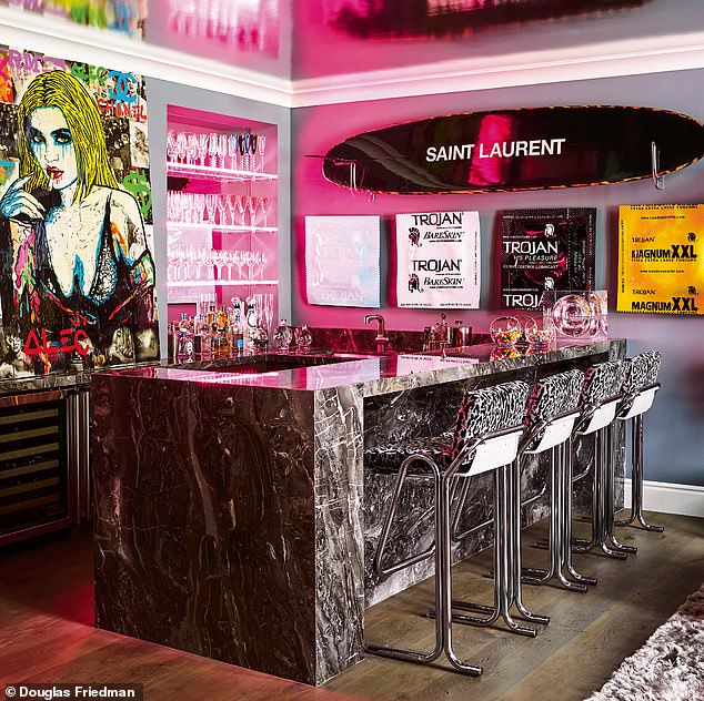 The bar area is dominated by a portrait of Jenner by street artist Alec Monopoly.  See also the Saint Laurent surfboard and Beau Dunn condom art.  Try cultfurniture.com for leopard spot stools