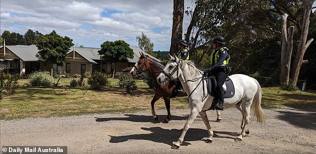 Police on horseback take a look at Murphy's property in Ballarat East