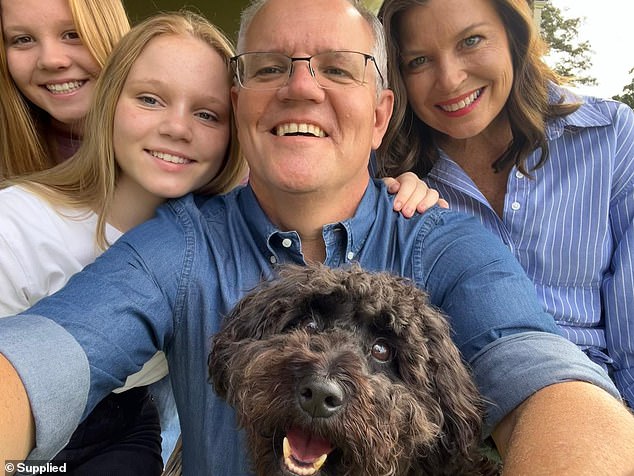 Morrison (pictured in a selfie with his wife Jenny, their two daughters and their dog) has attacked Mr Albanese.