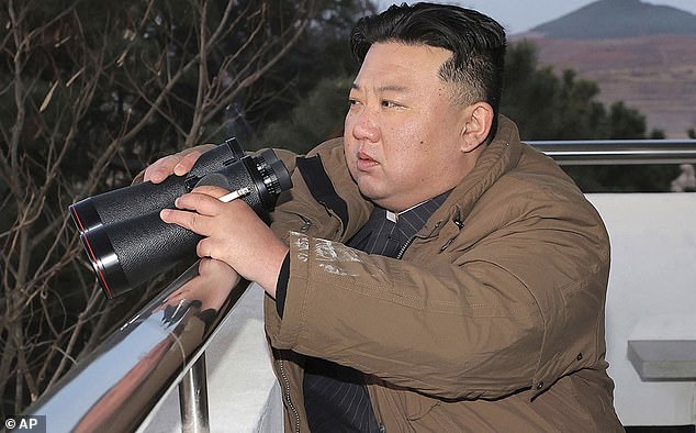 North Korean leader Kim Jong Un looks at what he says is an intercontinental ballistic missile the country test-launched at Sunan International Airport in Pyongyang, North Korea.