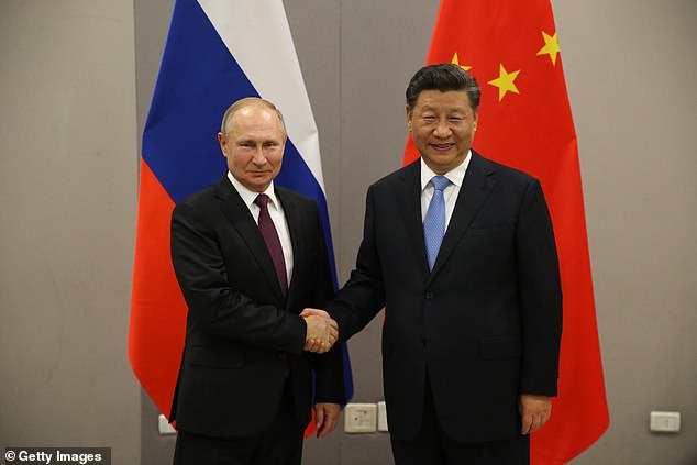 Russian President Vladimir Putin (L) meets with Chinese President Xi Jinping (R) in 2019. US adversaries are forging closer ties and cooperation, former Trump adviser warns