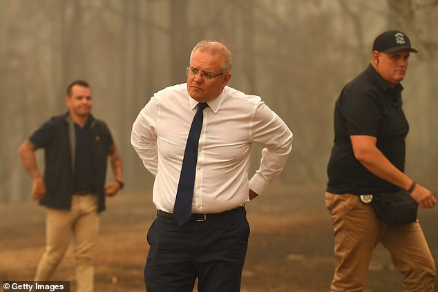 The prime minister sparked outrage in December 2019 after vacationing in Hawaii as Australia dealt with one of its worst bushfire seasons. Pictured: Scott Morrison visiting bushfire-affected Sarsfield in Victoria