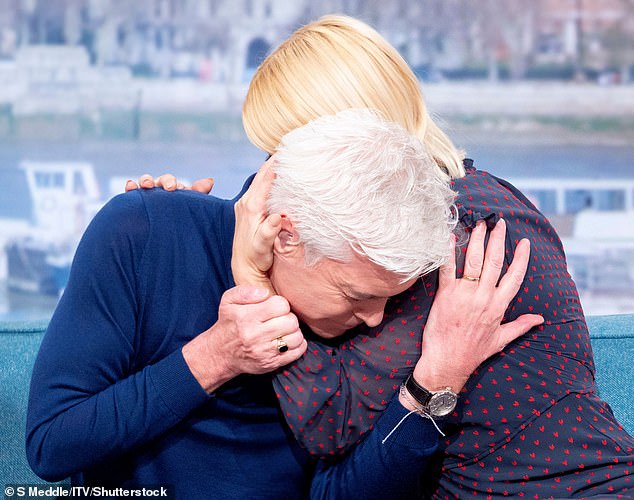 Phillip Schofield and Holly Willoughby embrace as he comes out as gay on the TV show 'This Morning' in 2020 before the pandemic.