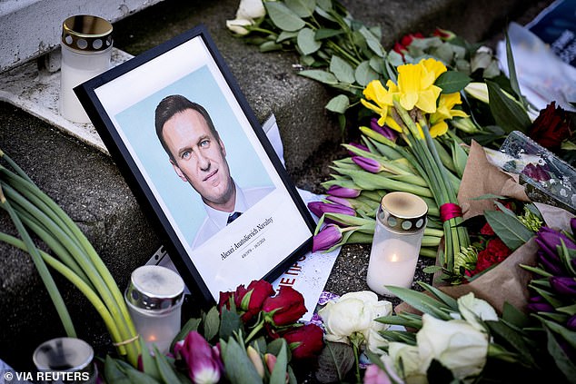 Tributes are paid as people demonstrate outside the Russian embassy in Denmark.