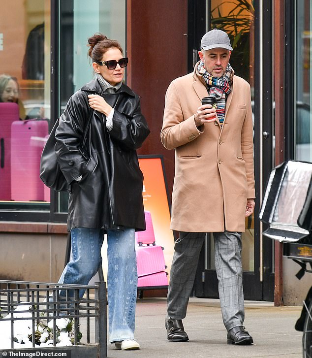Sporting dark designer sunglasses and carrying a leather bag, the star bundled up in a gray turtleneck during the chilly jaunt to the Big Apple.