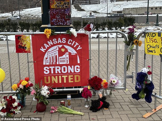 Flowers, signs and other items gather in front of Union Station on Friday, February 16, 2024 in Kansas City, Missouri.