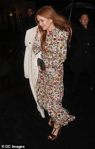 The actress, 48, looked radiant as always in a long-sleeved midi dress with a multicolored floral print.