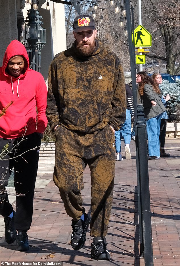Kelce was wearing brown sweatpants and a matching hoodie with black sneakers.