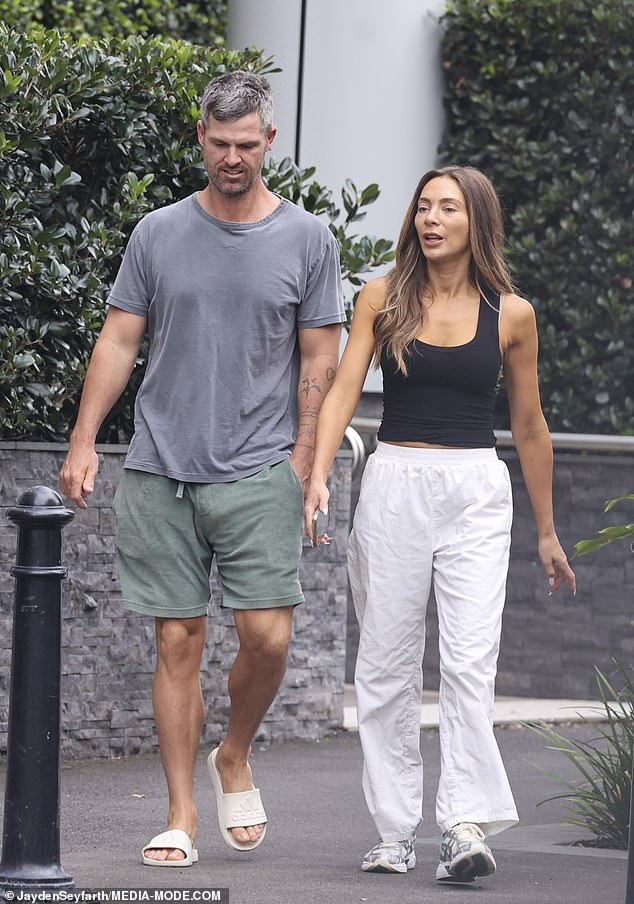 Nadia, best known for her split from football star Jimmy Bartel, arrived at the studio with her new boyfriend Peter Dugmore (left)