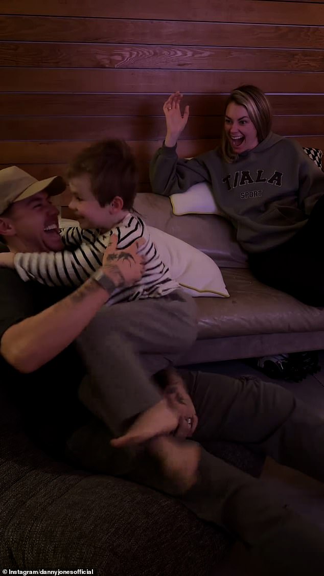His parents burst out laughing as Cooper jumped off the couch and ran to climb into his father's lap and hug him.