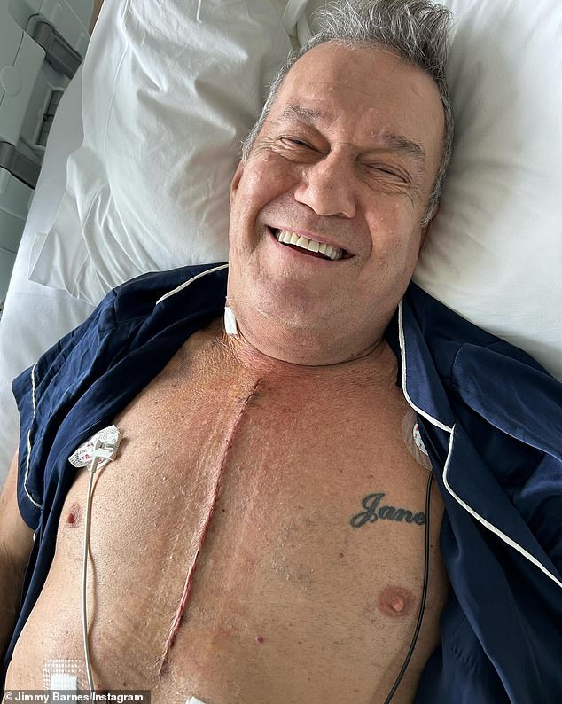Jimmy Barnes shows off the scar left by his open heart surgery, with a tattoo of his wife Jane's name also visible