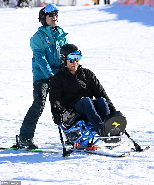 Harry tried out one of the competitors' sit-skis and appears to be having fun as his instructor pushes him down the slope.