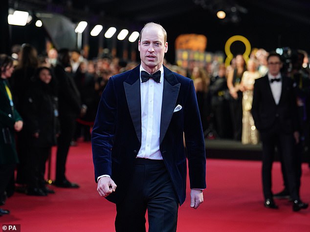The 42-year-old royal walks the carpet alone at the Royal Festival Hall ahead of tonight's ceremony.