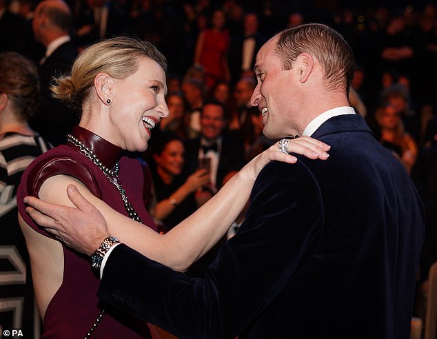 A hug for Cate: Blanchett puts her arm on the Prince of Wales's shoulder as the couple greet each other