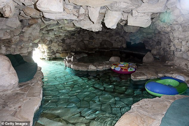 The former Playboy model recalled how Timberlake stripped down to his shorts and jumped into the mansion's infamous grotto (pictured).