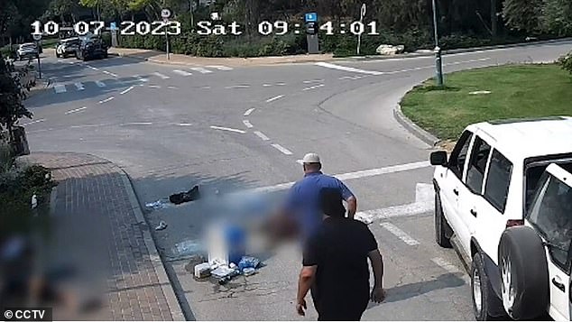 The footage shows the two men approaching an off-duty IDF soldier who was lying motionless on the road.