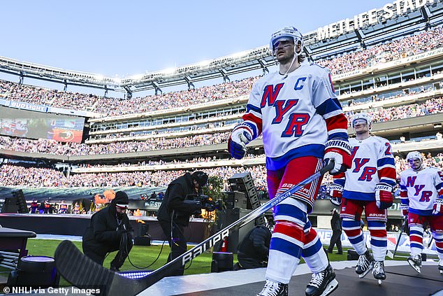 Jacob Trouba of the New York Rangers enters the arena before the game against the Islanders