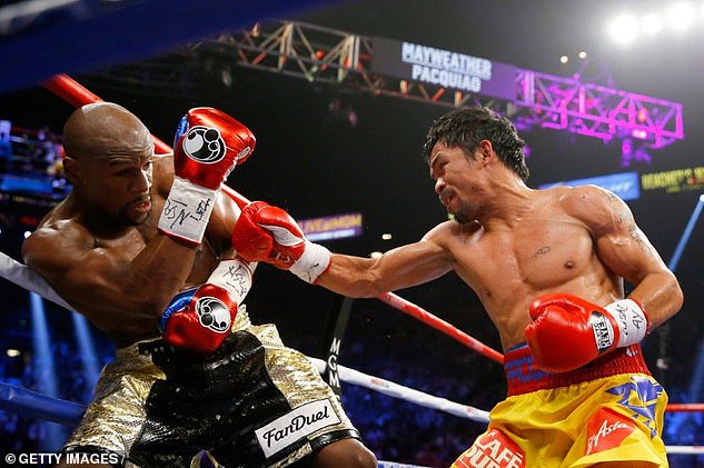 Pacquiao in action against Floyd 'Money' Mayweather during an incredible boxing career
