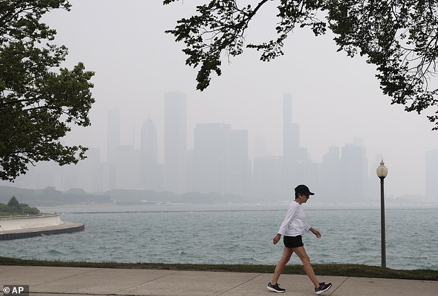 The Chicago skyline is covered in haze from the Canadian wildfires, as seen from Solidarity Drive amidst heavy smog from the wildfires in Canada.