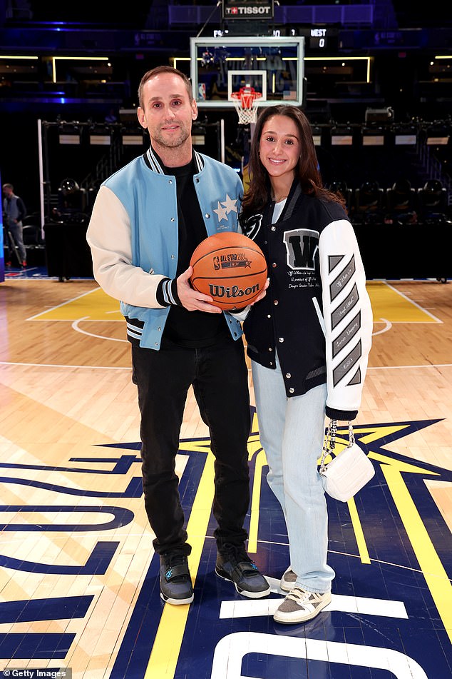 Michael Rubin and Kylie Rubin pose on the court before the 73rd NBA All-Star Game