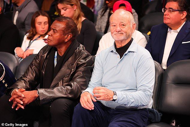 Bill Murray is seen on the court at the All-Star Game, sitting with sportscaster Ahmad Rashad.