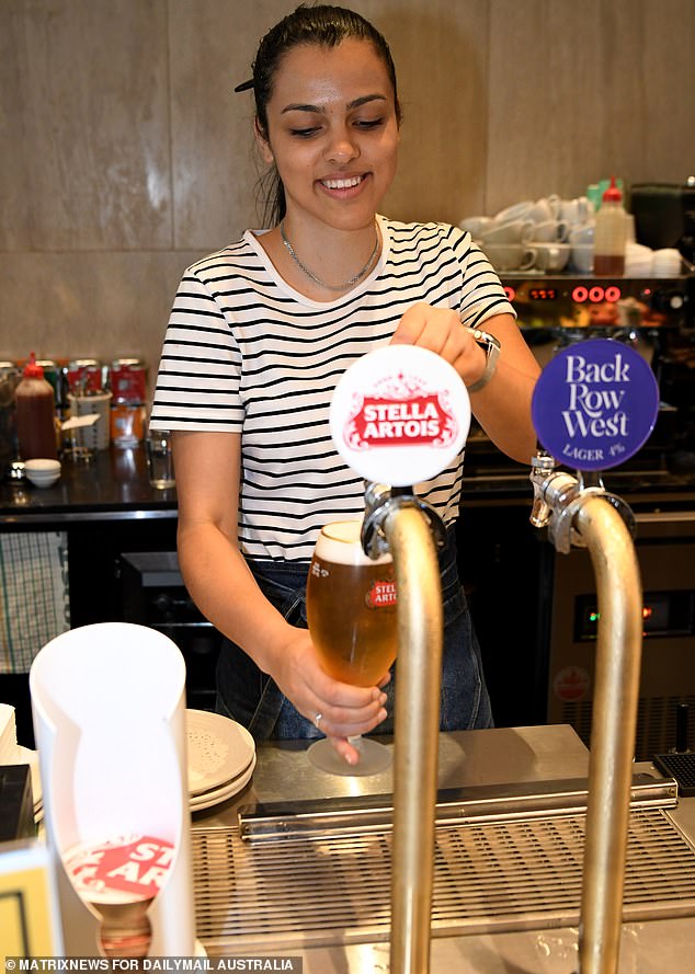Deloitte's 'Right Sizing The Workforce' report estimated that the recent surge in immigration meant the country was home to 693,600 more working-age people than before the pandemic (pictured, a Sydney bartender).