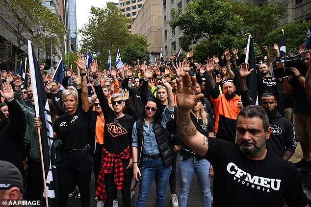 The Construction, Forestry, Mining and Energy Union continued to negotiate enterprise agreements worth $120,000 for traffic controllers on major construction projects in Victoria, covering major road and rail projects (pictured, CFMEU protesters in Melbourne ).