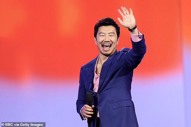 Liu's third look was a dark blue suit coat with a light pink dress shirt, also slightly unbuttoned, showing a dangling necklace.