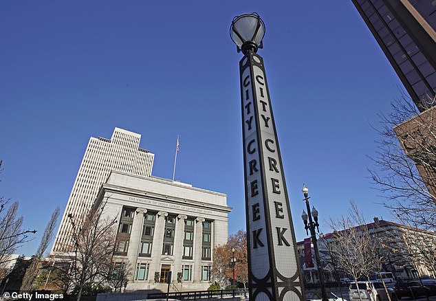 A City Creek Center sign sits in front of the world headquarters of the Church of Jesus Christ of Latter-day Saints in Salt Lake City, Utah.