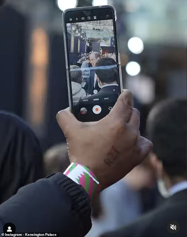 CREATIVE: An artistic shot of the video showed an event attendee filming Prince William on his own mobile phone.