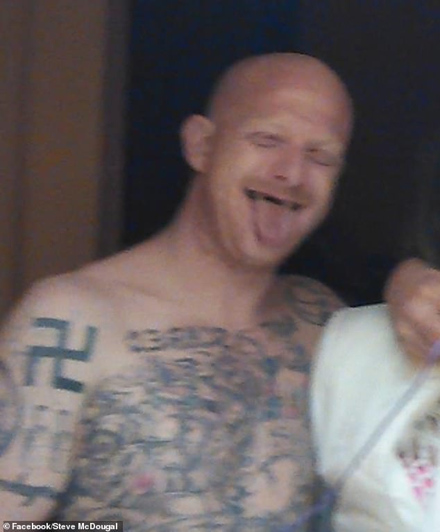 In several photos posted online, McDougal proudly shows off his swastika tattoo.