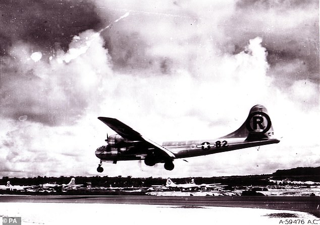 Enola Gay is seen landing after her infamous mission to drop a nuclear bomb on Hiroshima in August 1945.