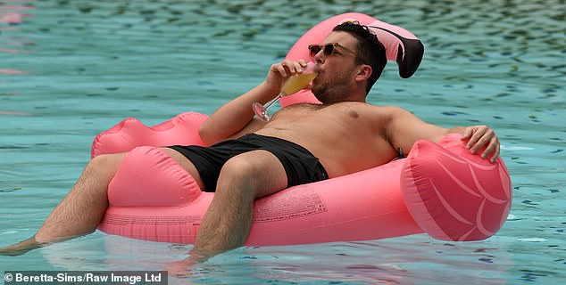As soon as Diags dried off, he went back inside, but stayed out of trouble by floating on a pink flamingo and drinking a drink.