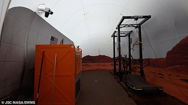 In the photo, a treadmill on which volunteers walk suspended from straps to simulate the lower gravity of Mars.