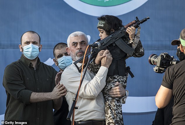 Yahya Sinwar, elected Hamas leader, appears during a ceremony honoring fighters killed by Israeli airstrikes at the Yarmouk soccer stadium in Gaza City, May 24, 2021.