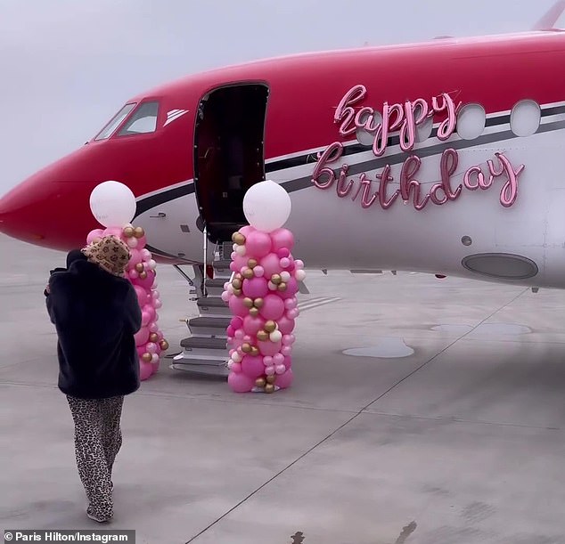 In her first shot, the reality show powerhouse, who recently held a lavish birthday party for her son, is seen boarding a private plane, which had been decorated with several balloons.
