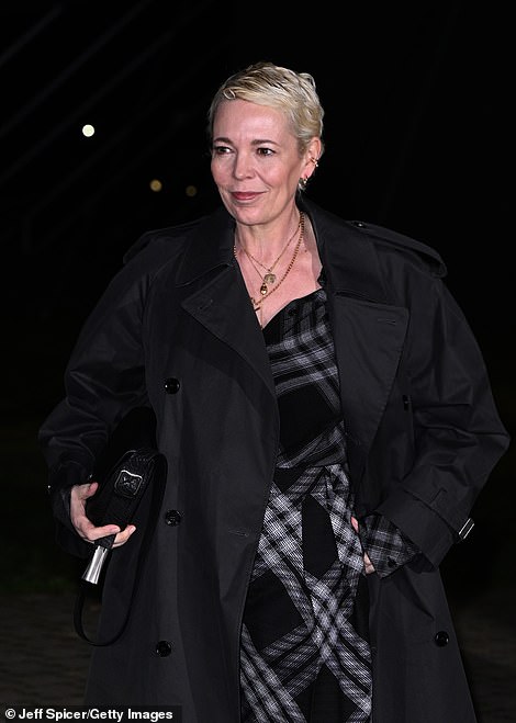 Oscar winner Olivia, 50, opted for an elegant long checkered dress which she paired with a chic trench coat.