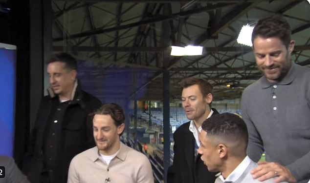 The 30-year-old entered the Sky Sports studio before the match to meet the likes of Neville and Luton captain Tom Lockyer (second left).
