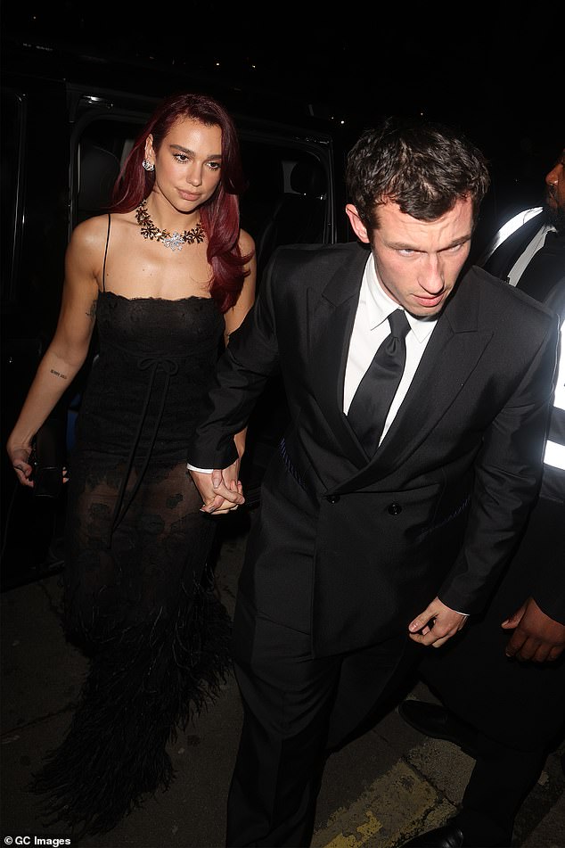 Dua and Callum looked as in love as ever as they shared loving glances while leaving the British Vogue and Tiffany & Co. BAFTA after-party at Annabel's on Sunday (pictured).