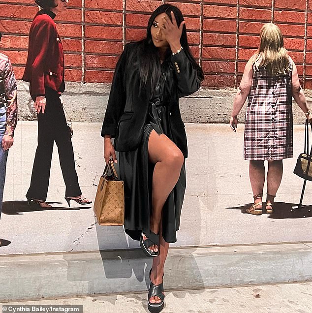 The Bravo star donned an all-black outfit that included a leather dress, which showed off her curvy thighs as she posed for photos.