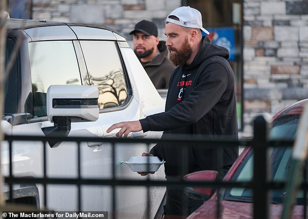 The NFL champion and his friend left the indoor golf course after a four-hour session with some local takeout.
