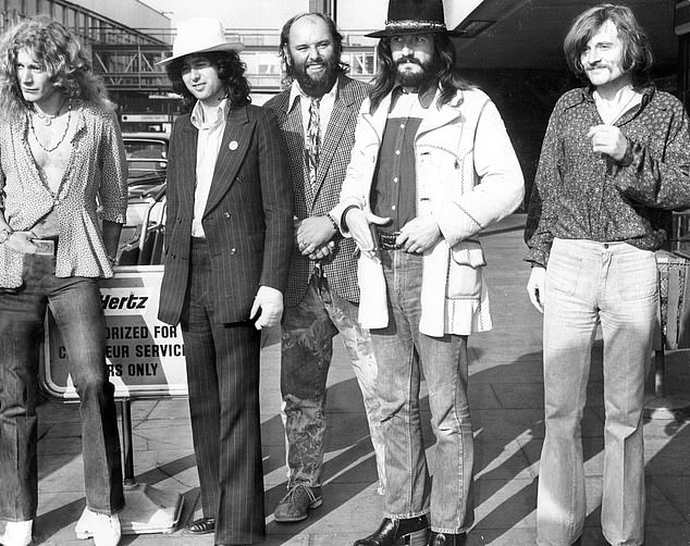 Pop group Led Zeppelin with their manager Peter Grant (centre) at Heathrow Airport in 1973.