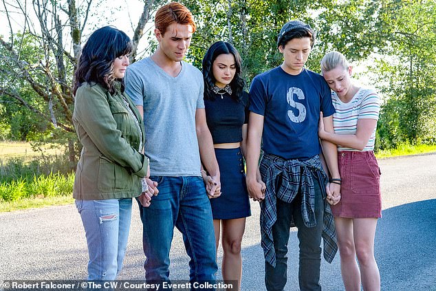 Shannen Doherty, KJ Apa, Camila, Cole Sprouse and Lili Reinhart are shown in a still from an October 2019 episode of Riverdale.