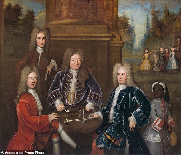 Elihu Yale and members of his family sit at a table with tobacco pipes and wine glasses, while an enslaved boy with a metal collar around his neck looks on