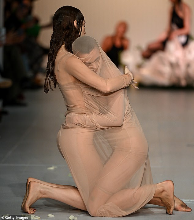 The couple then embraced each other in a warm embrace through their nude mesh dresses.