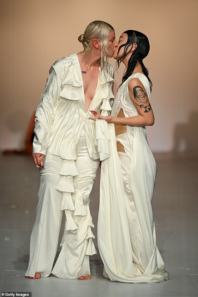 In an unusual addition to the show, a pair of models kissed as they reached the end of the runway.