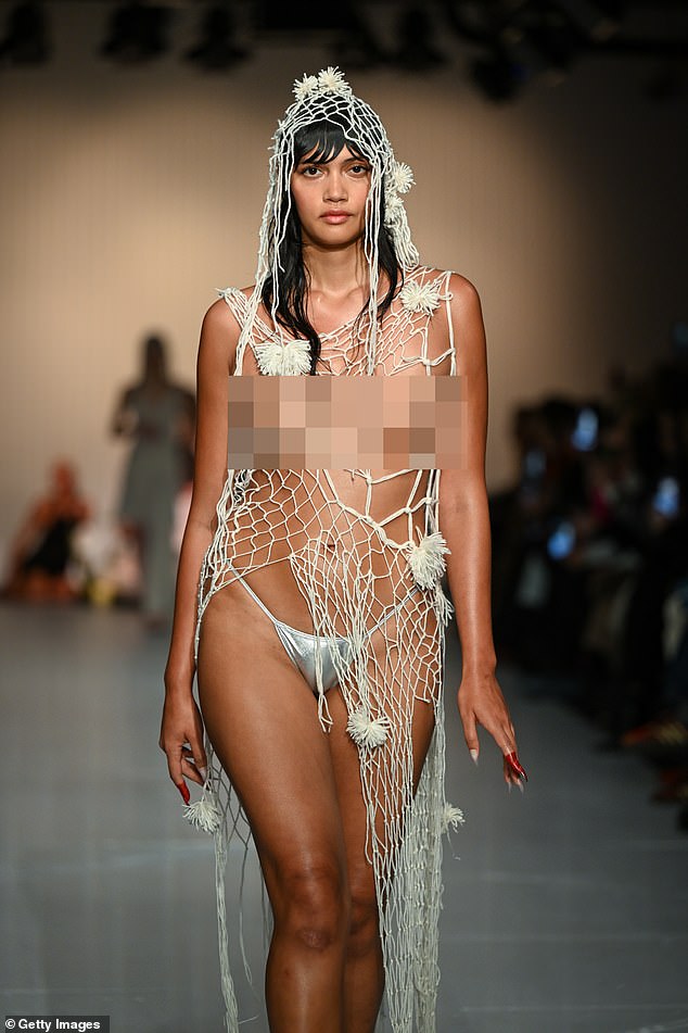 In another daring look, a model bravely went on the run in a barely-there crochet dress and headpiece.