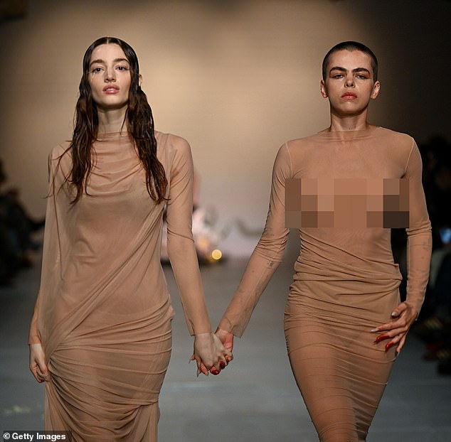 The couple completed their unique performance by strutting down the catwalk holding hands.